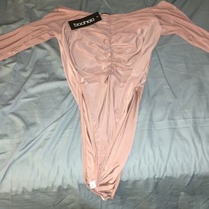 A boohoo body suit color cream
